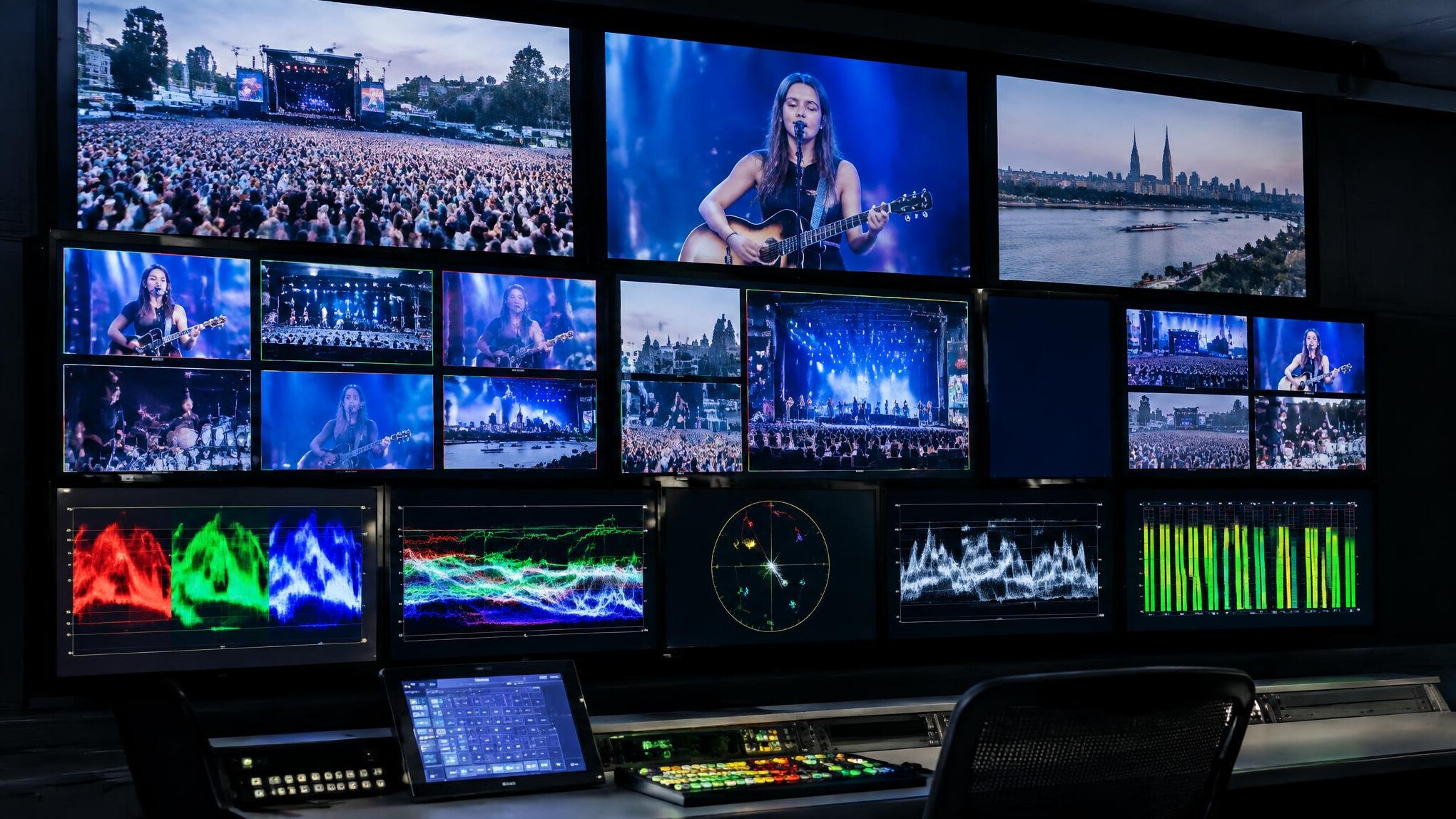 Wall of monitors displaying live video signal feeds in a broadcast facility